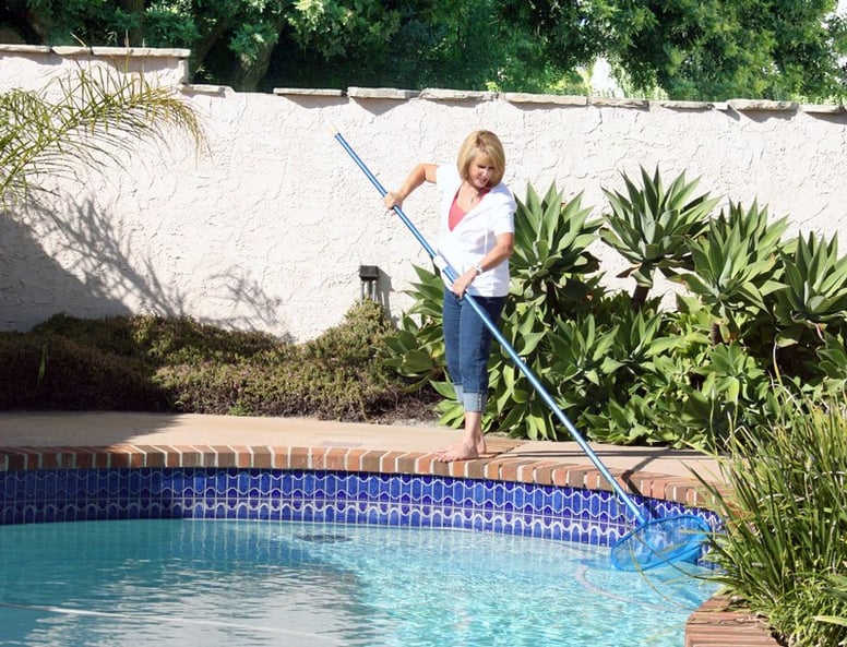 homeowner-cleaning-pool