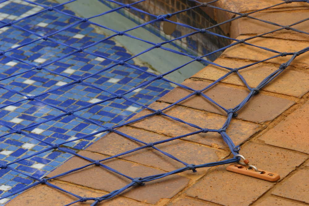 pool safety net in use on an inground pool