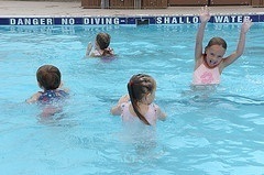 Kids play in swimming pool